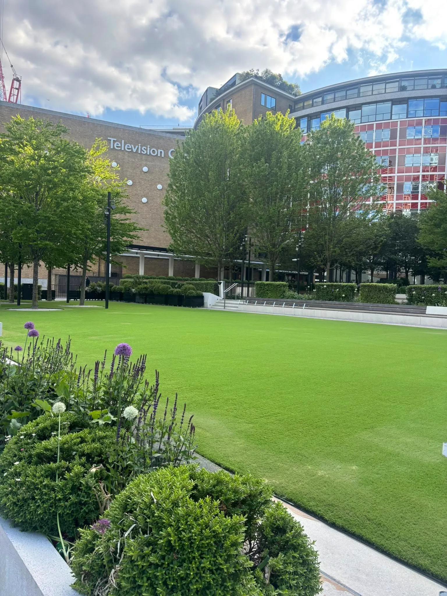 artificial grass around white shed