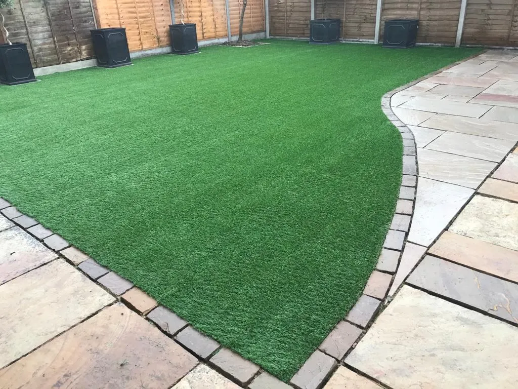 grass with small patio around