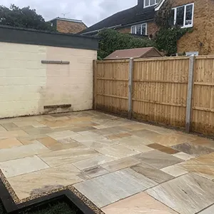 light patio with light brown fence